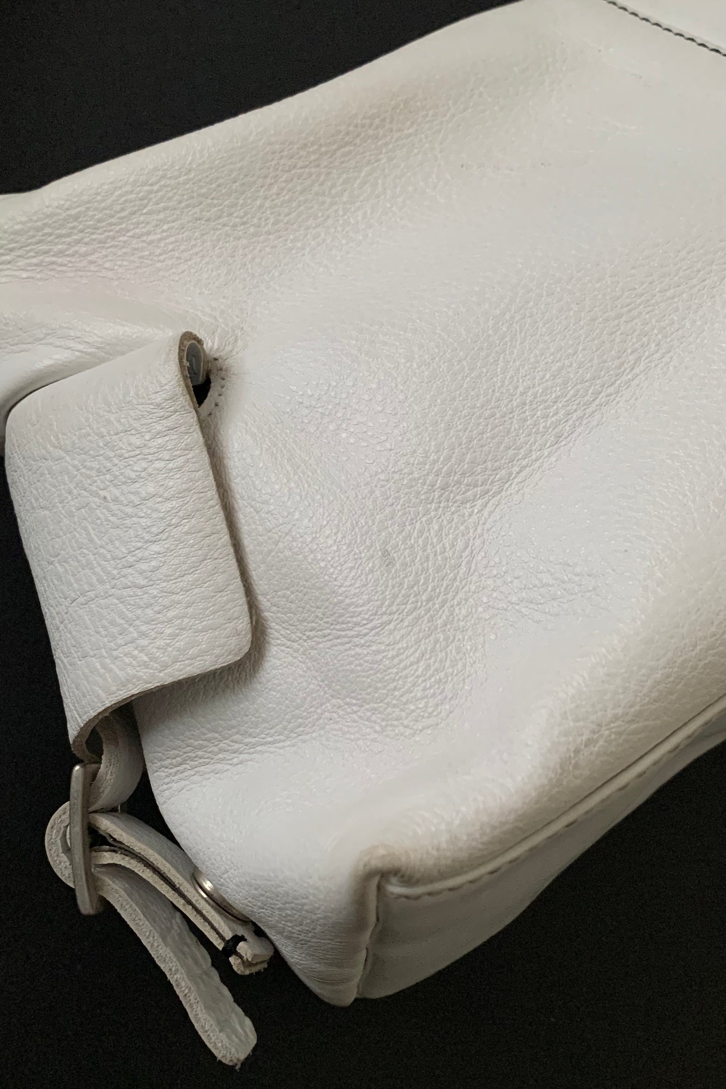 white leather side design bag