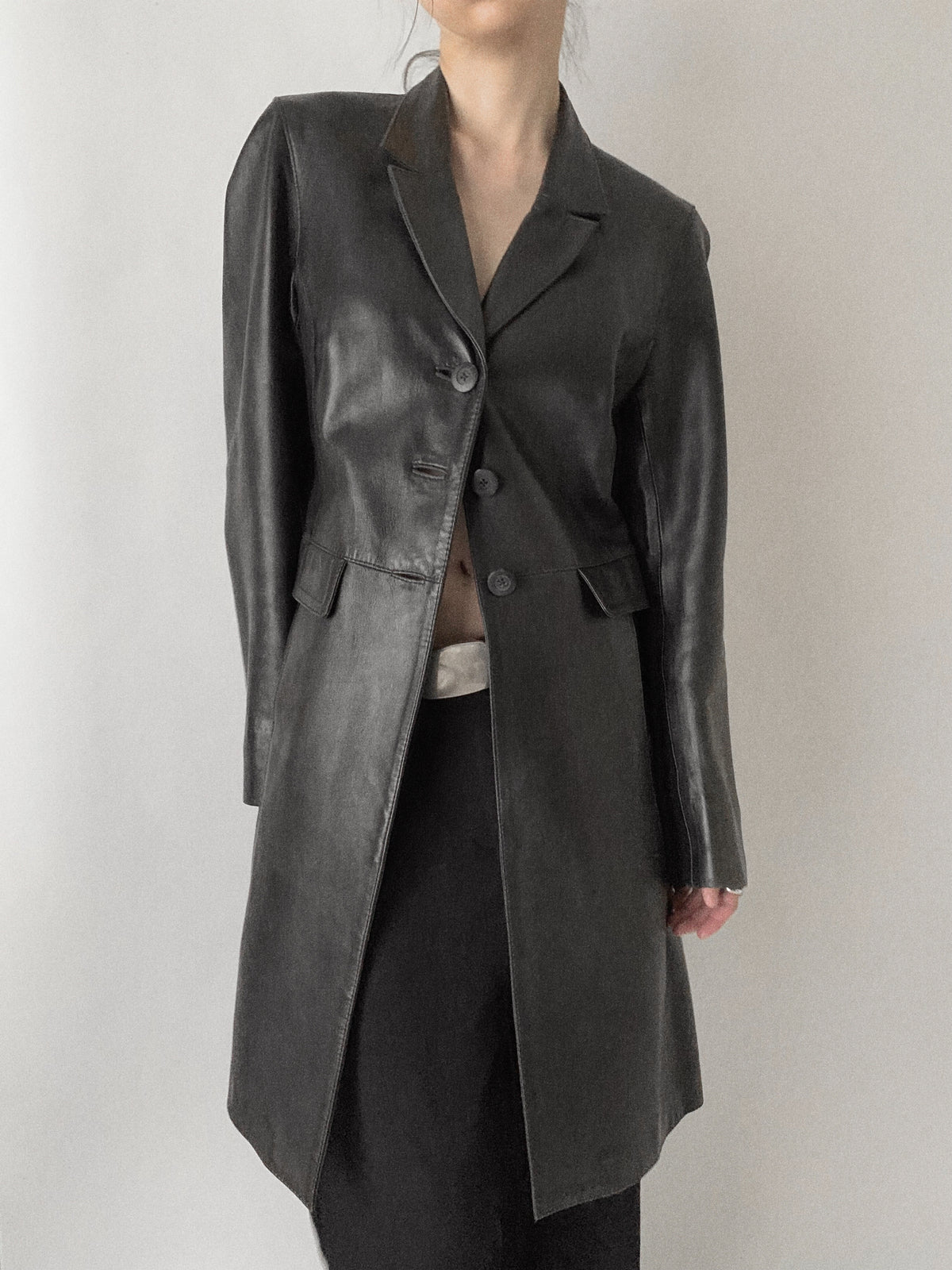 black aging leather coat