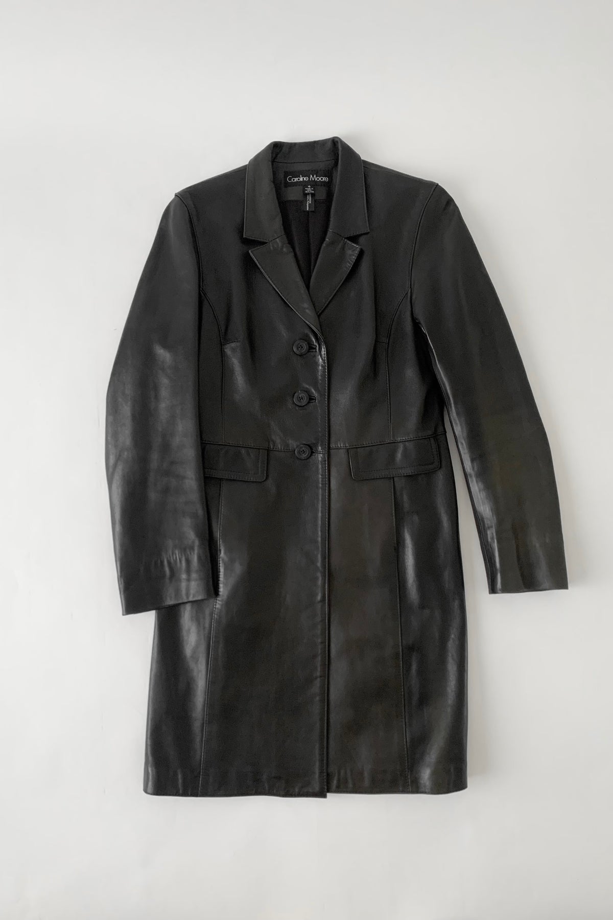 black aging leather coat