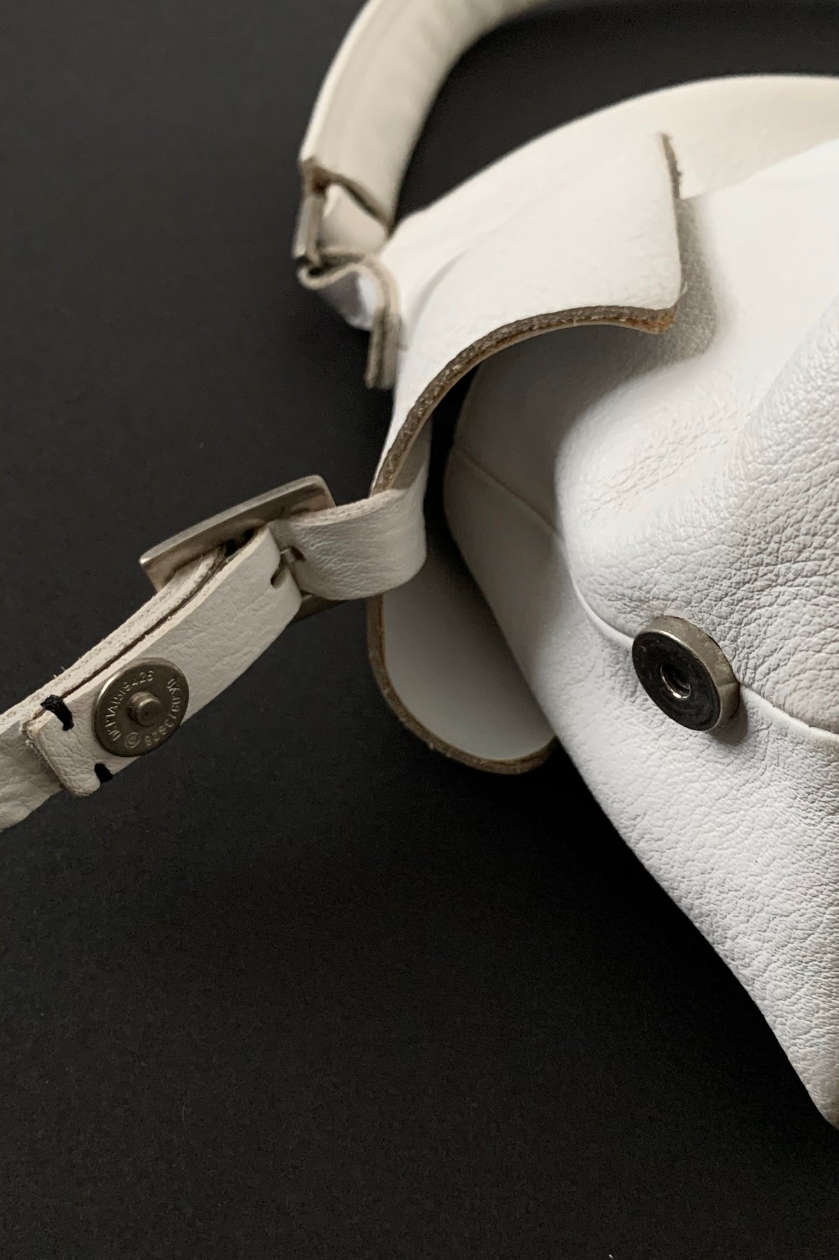 white leather side design bag