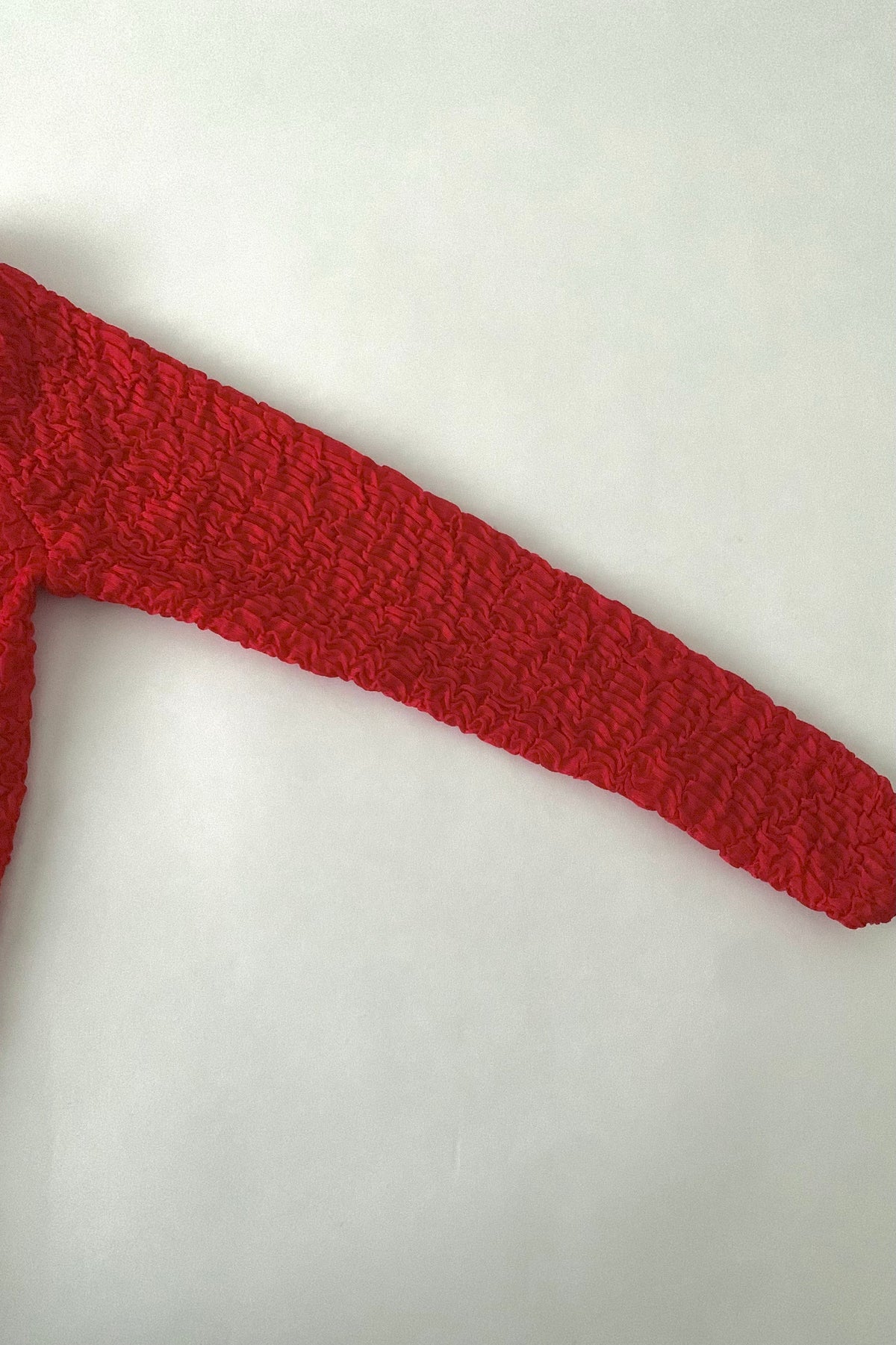 red ruffed long sleeve tops