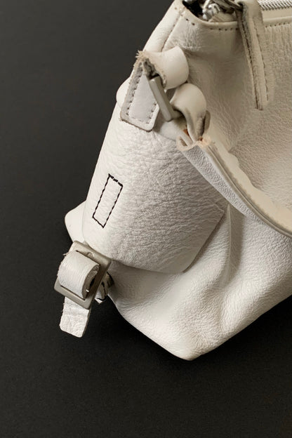 white leather side design bag